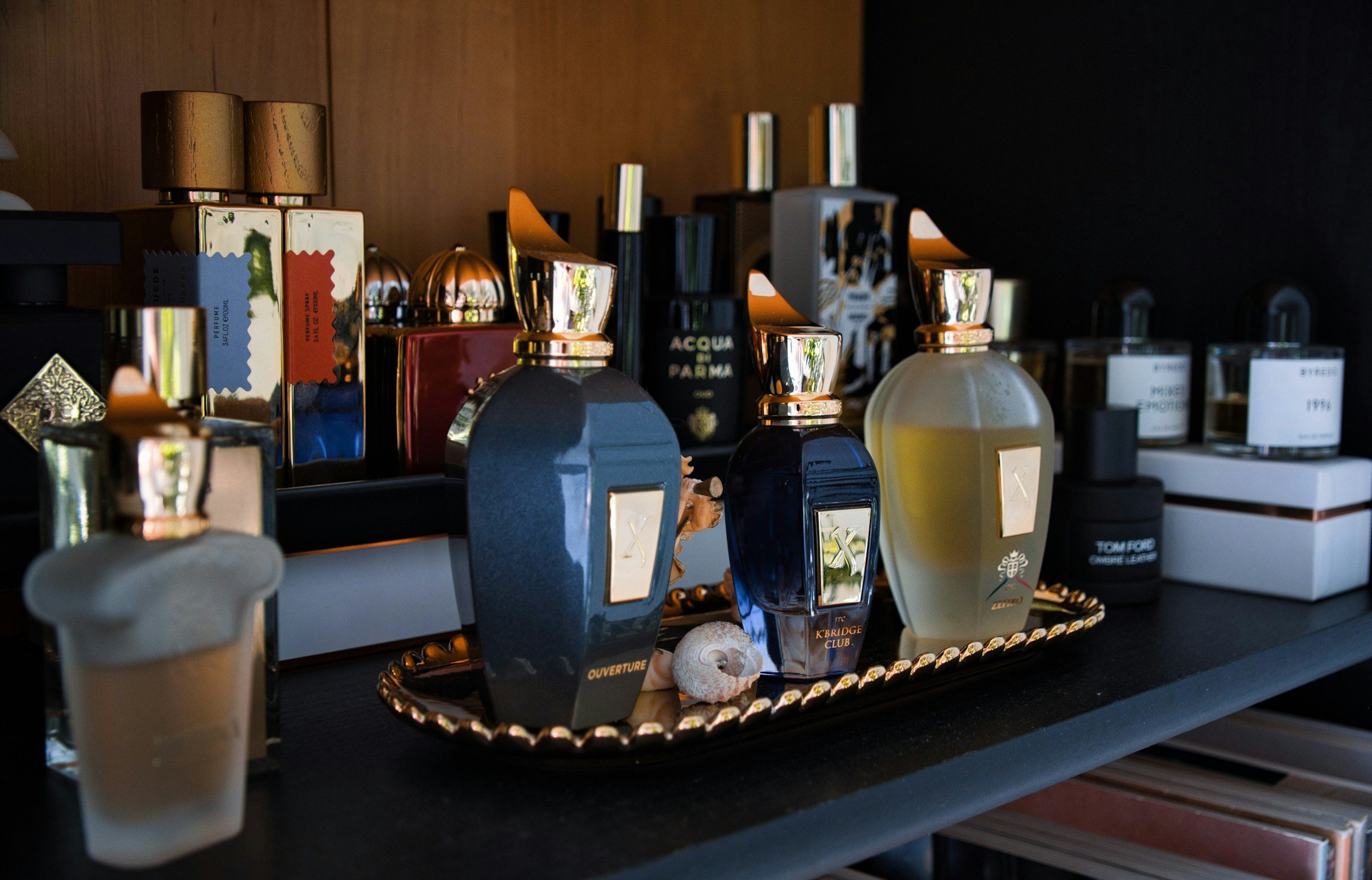 Designer perfume bottles on a dresser